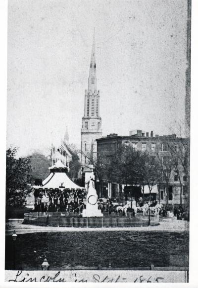 Lincoln's catafalque on Public Square, Cleveland, Ohio with monument statue of Oliver Hazard Perry in foreground April 28, 1865