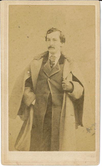 Card- Picture of John Wilkes Booth standing with coat (front) 